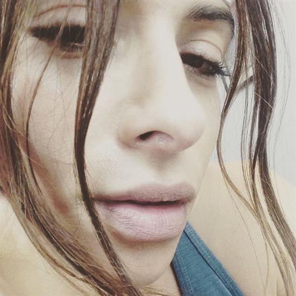 Sarah Shahi taking a selfie