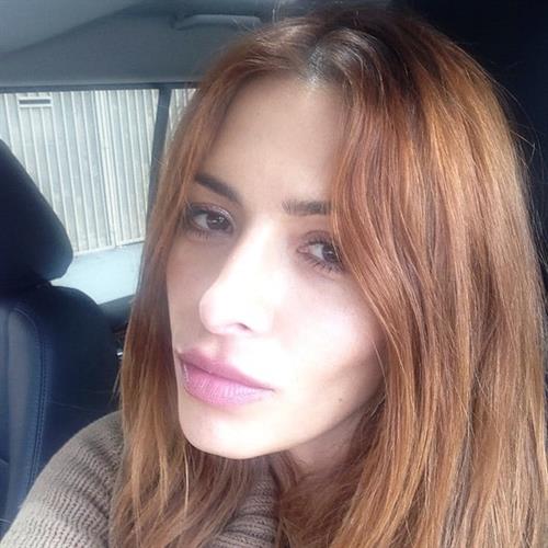 Sarah Shahi taking a selfie