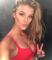 Nina Agdal in a bikini taking a selfie