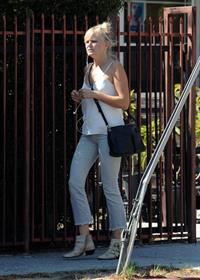 Malin Akerman braless tits showing off her boobs in a blouse top seen by paparazzi.












