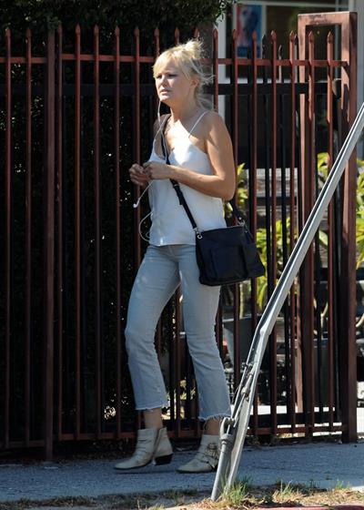 Malin Akerman braless tits showing off her boobs in a blouse top seen by paparazzi.












