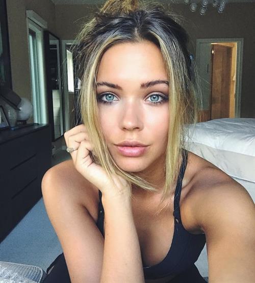 Sandra Kubicka in a bikini taking a selfie