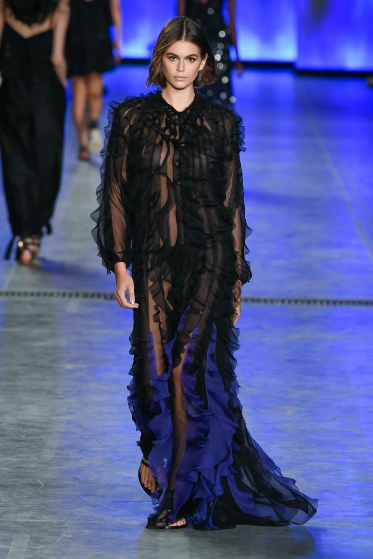 Kaia Gerber braless boobs in a see through dress modelling during fashion week.






























