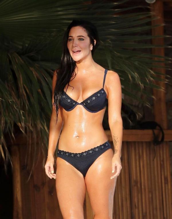 Tulisa Contostavlos big boobs showing nice cleavage and sexy ass in a bikini seen by paparazzi by the pool.


