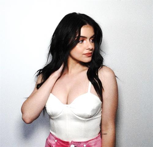Ariel Winter Pictures Ariel Winter sexy in a white top showing nice cleavage with her big tits.