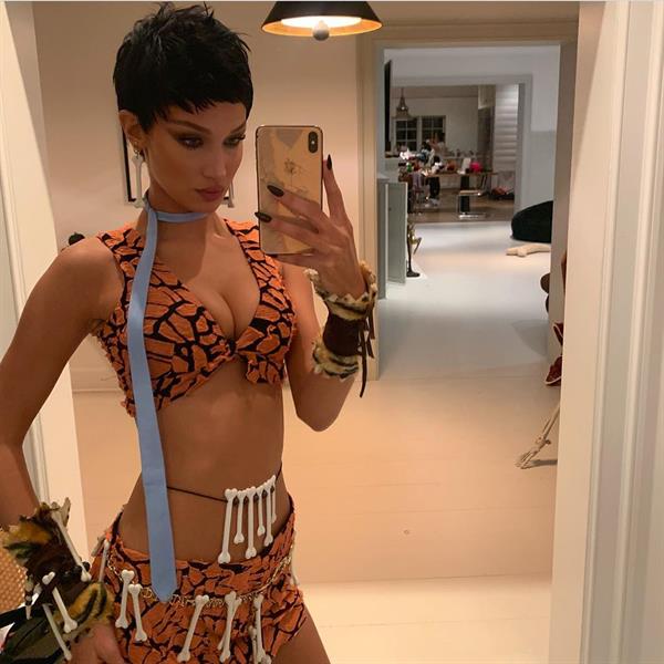 Bella Hadid sexy Halloween dressed up from The Flinstones showing nice cleavage.








