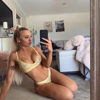 Tammy Hembrow in a bikini taking a selfie