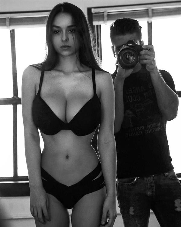Sophie Mudd in a bikini taking a selfie
