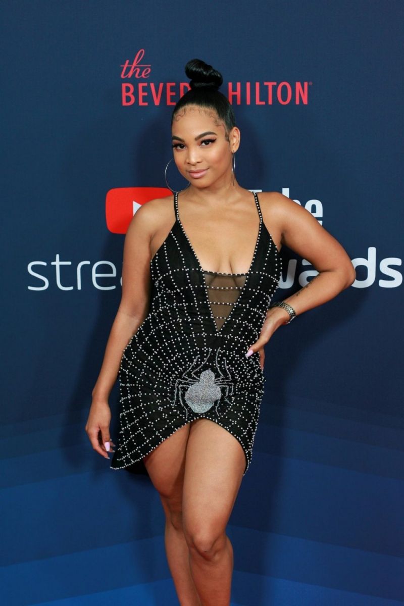 Aliya Janell Bikini Pictures Aliya Janell braless boobs showing nice cleavage in a sexy little low cut dress at the Streamy Awards.