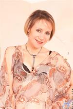 Naughty cougar from next door poses in her bra and sheer panties