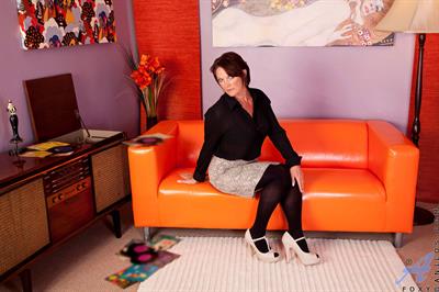 Sensual red head Foxy plays with her pussy at Anilos