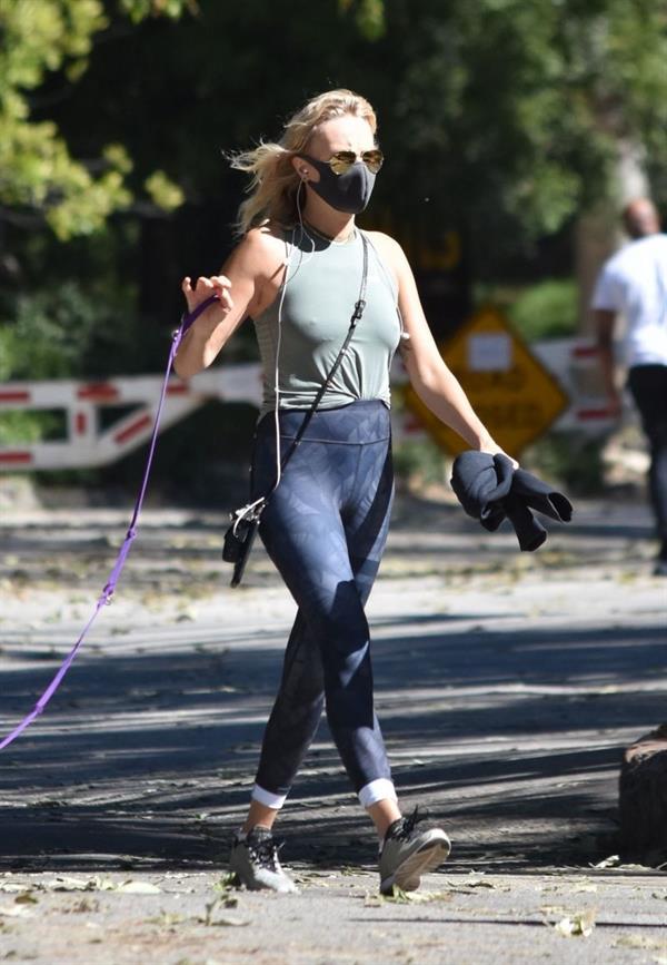 Malin Akerman braless boobs in a tank top showing off her big tits pokies seen by paparazzi while out walking her dog.