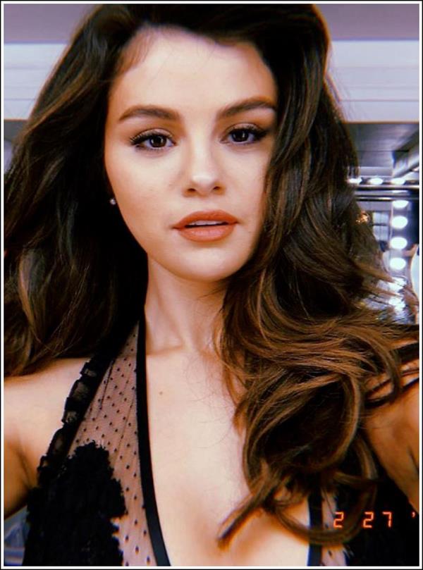 Selena Gomez shared a throwback photo wearing sexy black lingerie up close looking gorgeous.