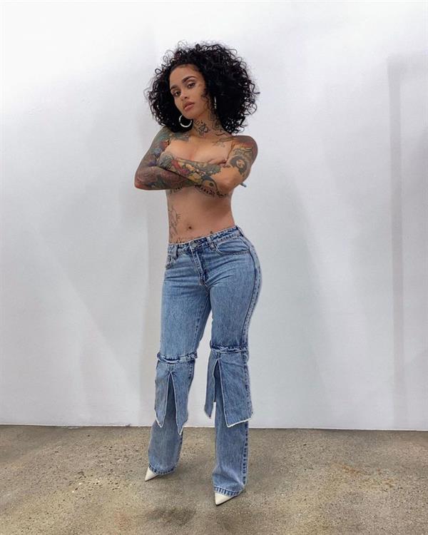 Kehlani topless boobs new photo standing wearing only jeans holding her nude big tits and showing her tattoos.