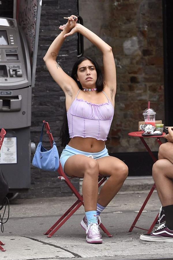 Lourdes Leon braless boobs in a sexy little purple top showing off her tits pokies as well as armpit hair seen by paparazzi smoking weed.