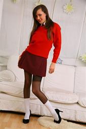  Naughty Nadia gives us a glimpse of whats beneath her college uniform.  