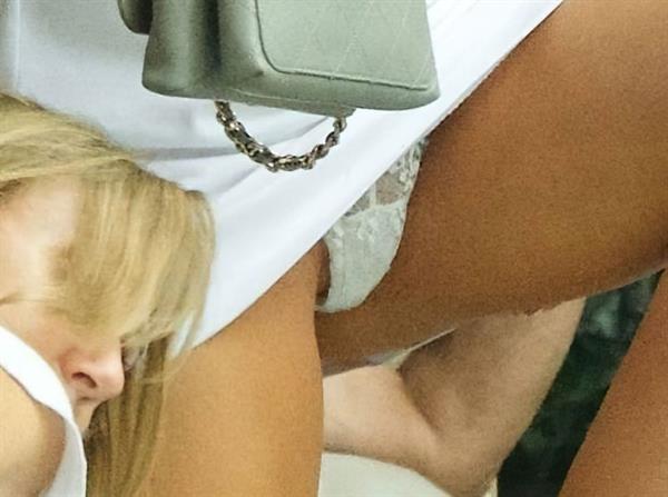 Kimberley Garner pussy flash upskirt wardrobe malfunction accidentally showing her panties seen by paparazzi.