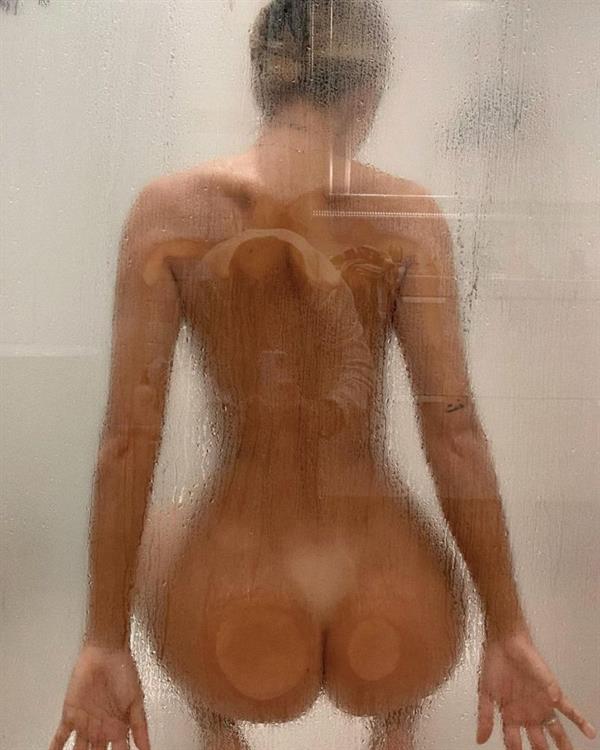 Pauline Tantot naked new photo wet in the shower with her nude ass pressed against the glass.