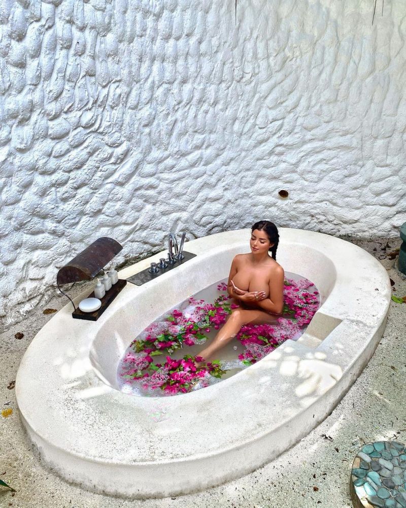 Demi Rose Mawby Pictures. Demi Rose nude boobs new photo posing fully naked  in an outdoor bathtub in the Maldives holding her topless big tits. Hotness  Rating = 8.88/10