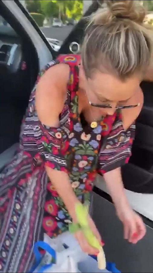 Kaley Cuoco nip slip wardrobe malfunction accidentally flashing her big tits bent over going through her groceries with her braless boobs.