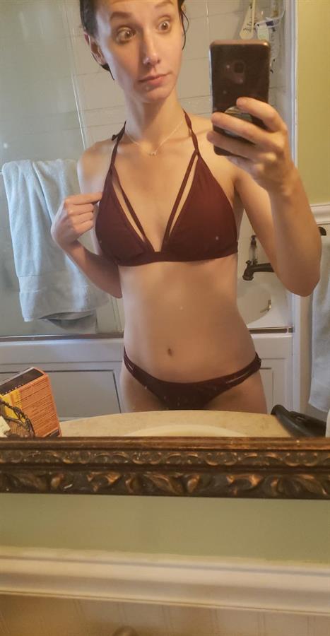 Liv in a bikini taking a selfie