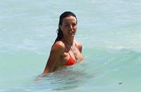 Kelly Bensimon in a bikini taking a selfie