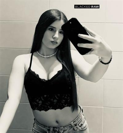 Emma in lingerie taking a selfie