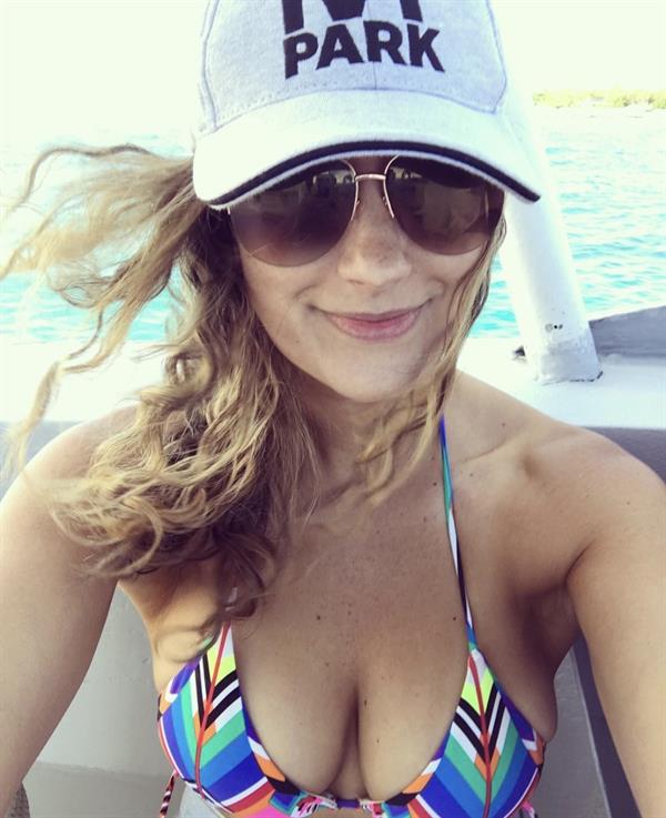 Heather in a bikini taking a selfie