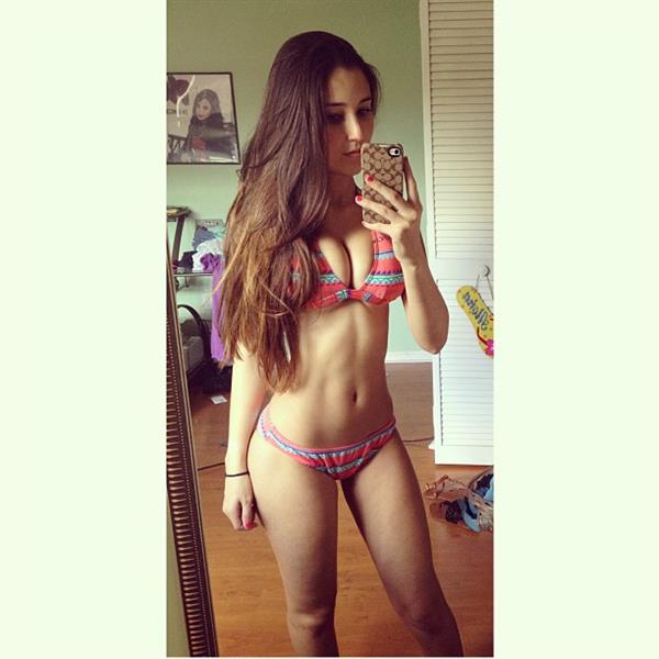 Angie Varona in a bikini taking a selfie