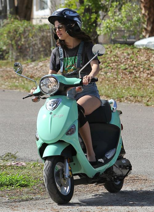 Selena Gomez rides a scooter on set of spring breakers on February 29, 2012 