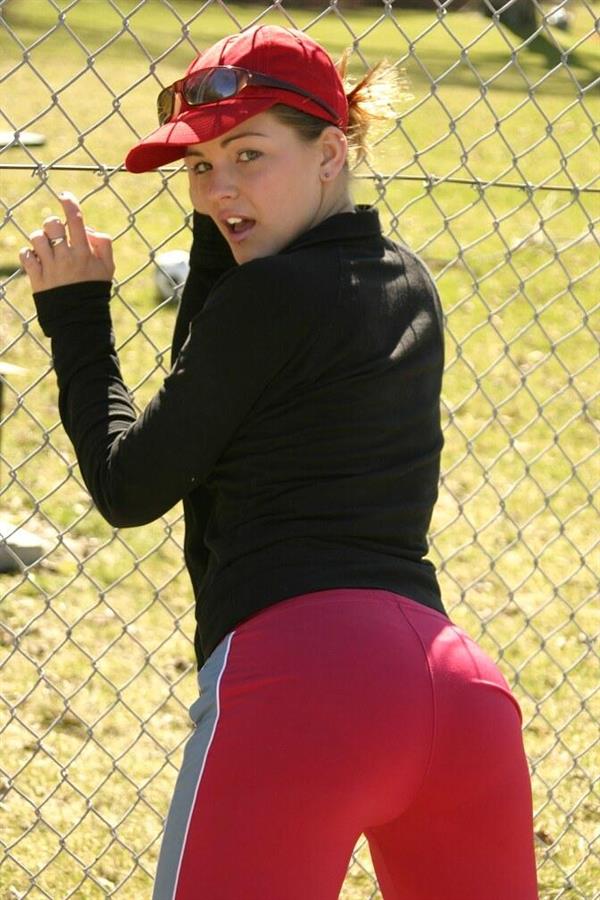 Sara Sexton has a little fun in the park and a red baseball cap